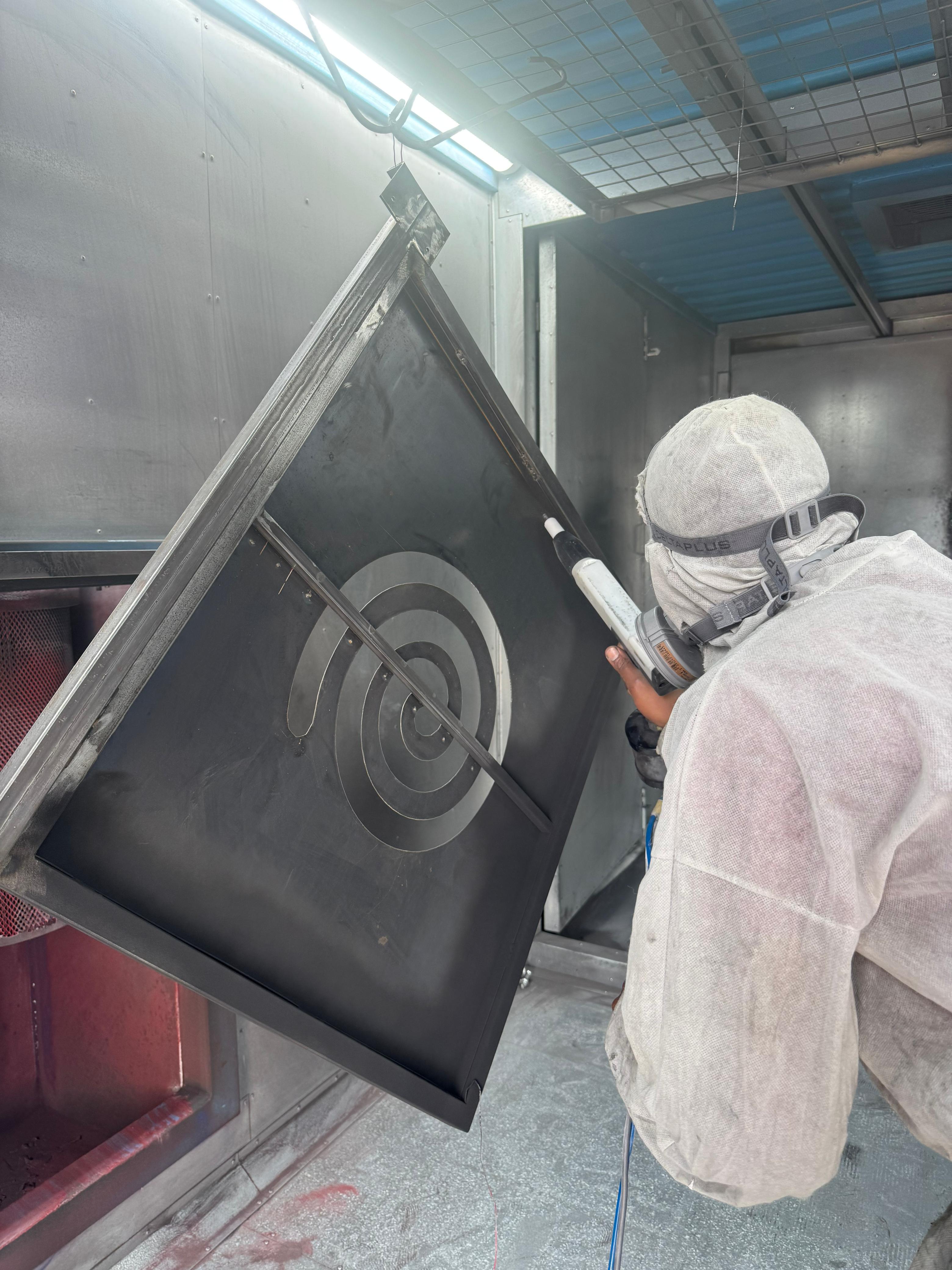 KCrea Manufacturing powder coating process in Kigali workshop